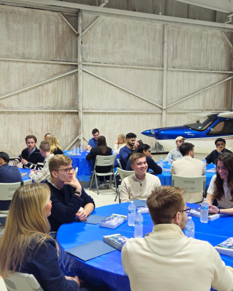 Students sitting by tables