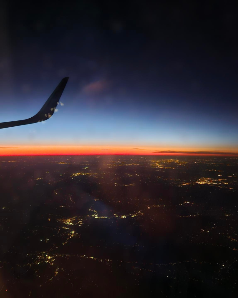 Plane flying abvoe city