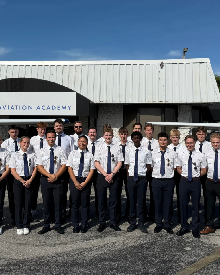 Student pilots in front of OSM building